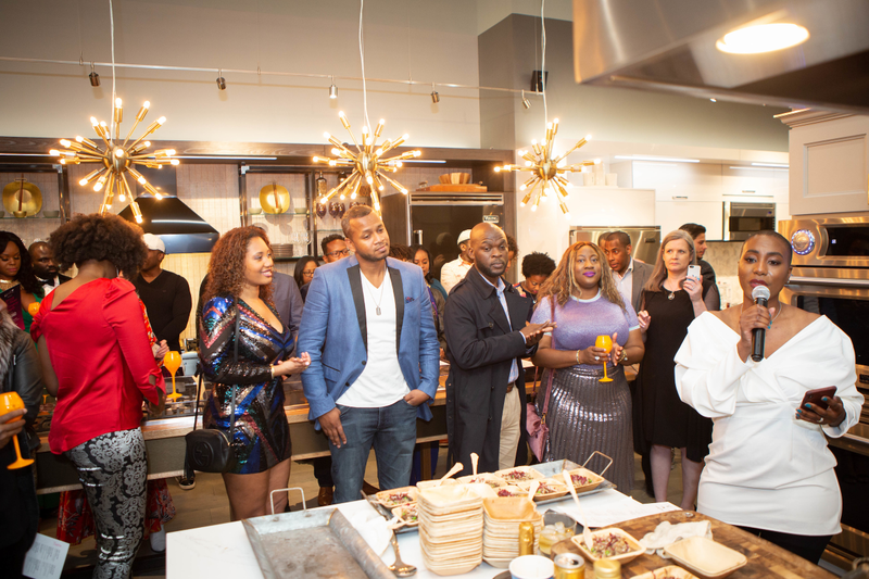 Dr. Lezli Levene Harvell (r) greets the crowd in one of the Viking showroom’s stunning display kitchens.